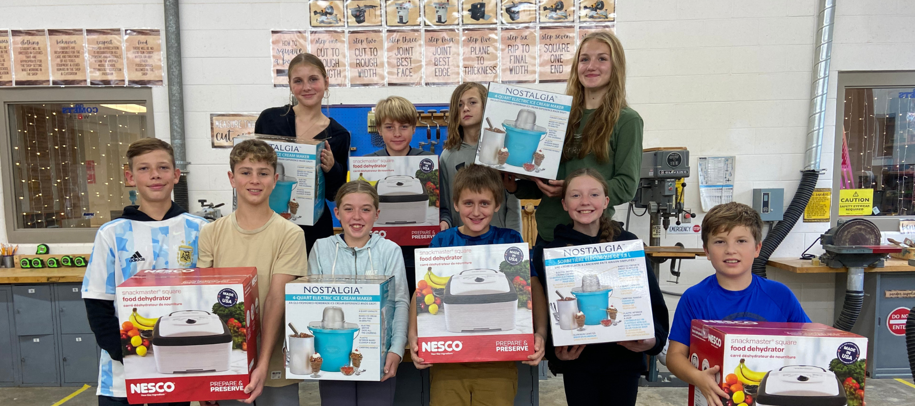 Agriculture students holding donated juicers and dehydrators